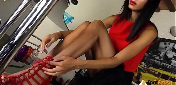  Stunning barefoot brunette spreading her toes